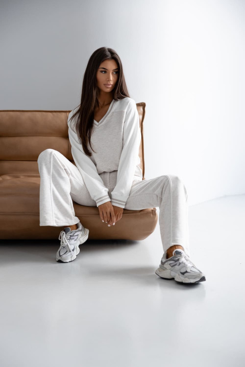 Two-piece beige women's set with a V-neck